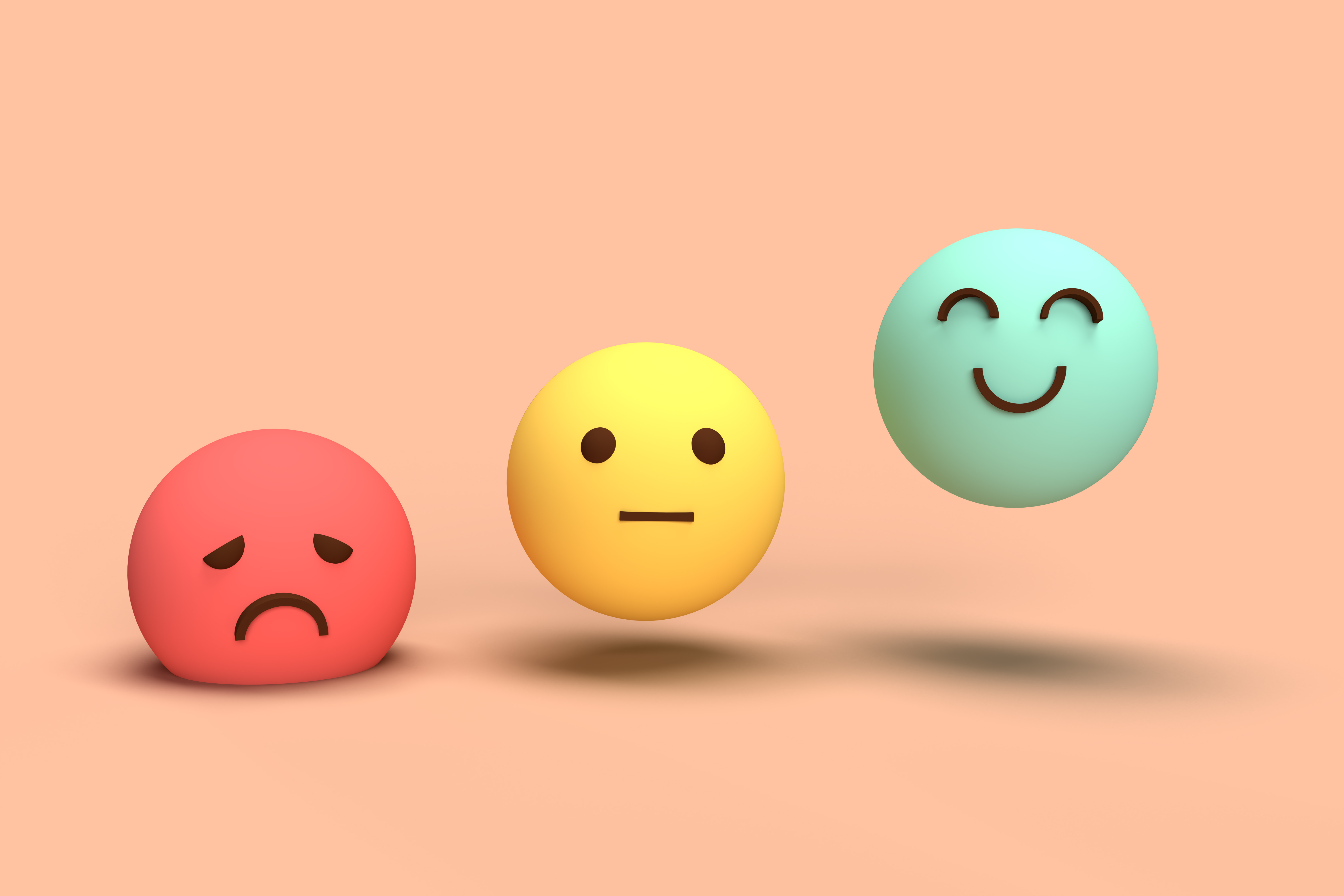 Drei Smileys, ein roter hat Mundwinkel nach unten, ein gelber hat geraden Mund, ein grüner hat lächelnden Mund / Mundwinkel nach oben